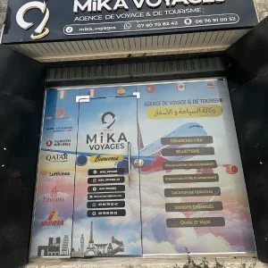 Habillage vitrine Mika Voyage